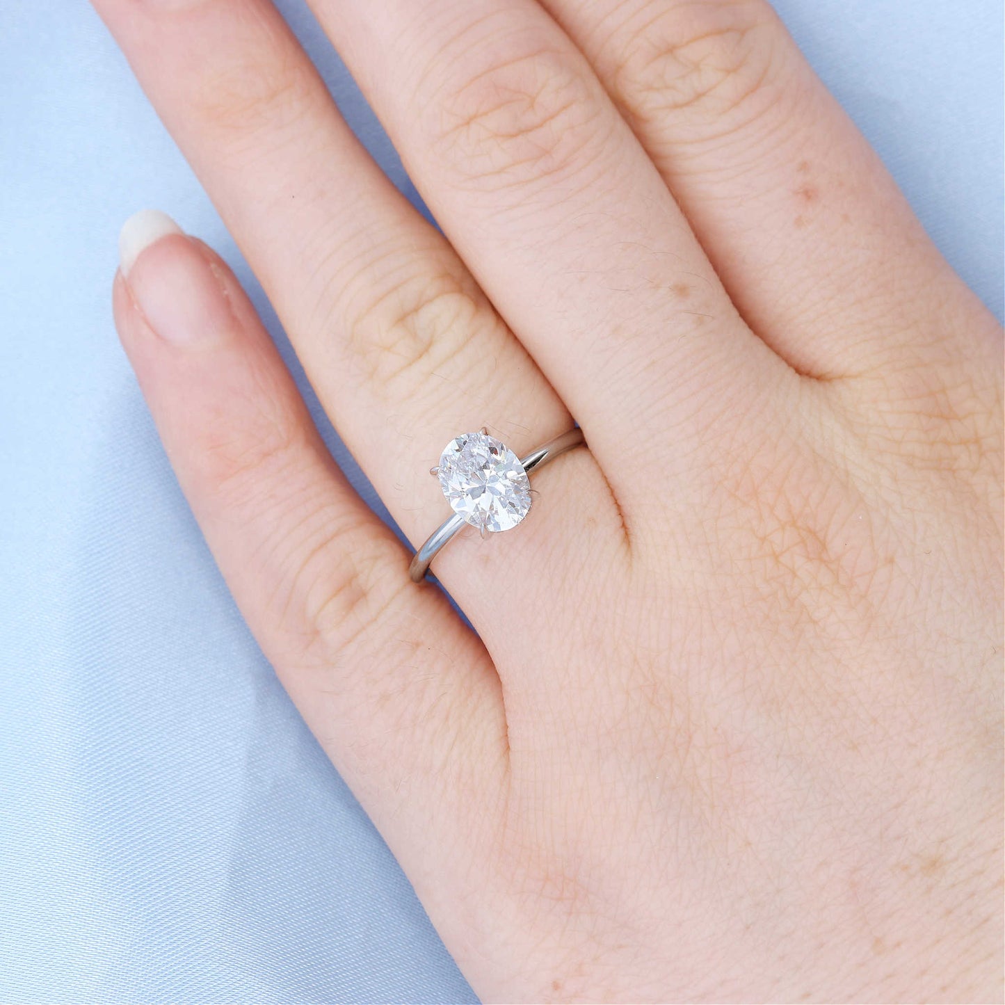 Oval Solitaire Hidden Halo Engagement Ring