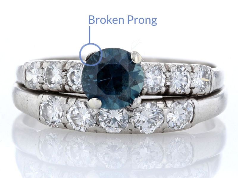 Teal sapphire wedding set with a broken prong, and many worn prongs.