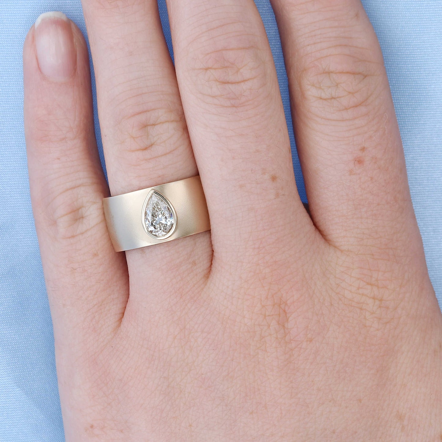 Wide Bezel Set Pear Engagement Ring