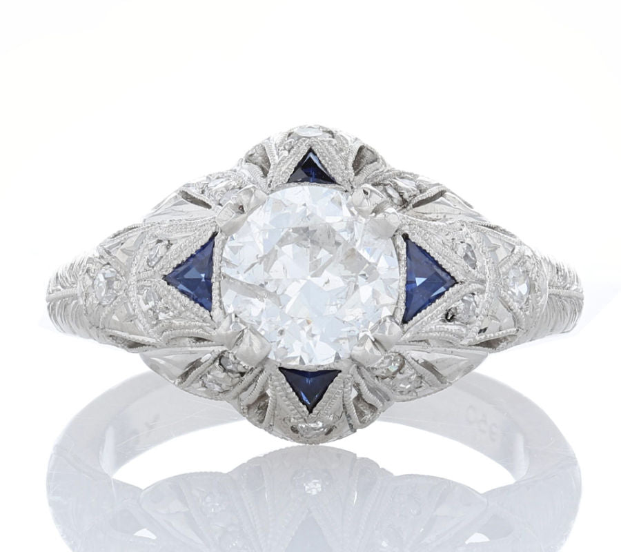 Diamond and sapphire Edwardian style engagement ring with hand engraving and milgrain