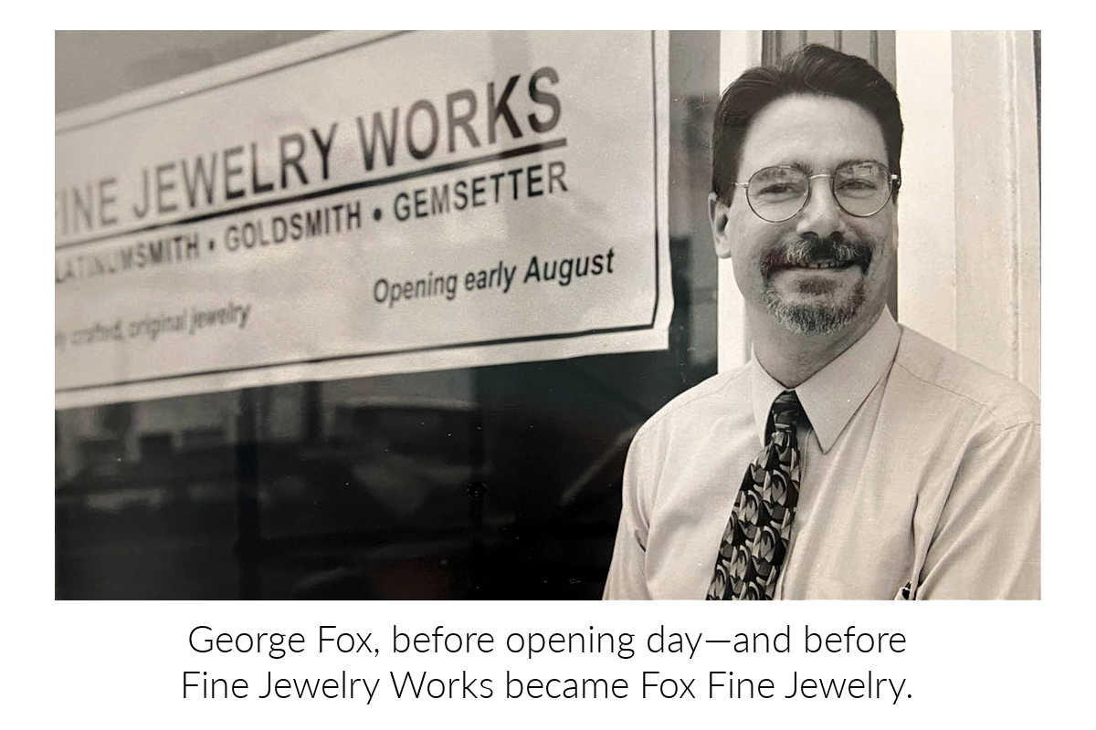 Black and white photo of a George Fox in front of a 'Fine Jewelry Works' sign. Reading 'George Fox, before opening day - and before Fine Jewelry Works became Fox Fine Jewelry.'.