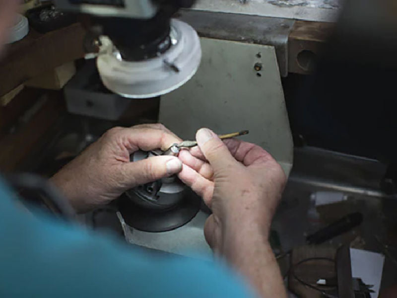 George Fox working on a repair at his workbench