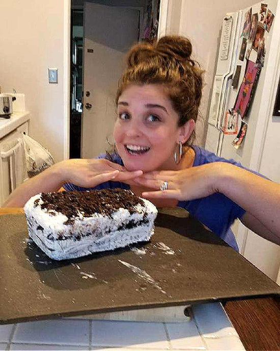 Jen Reed posing with her home made cake