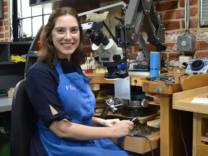 Karen Fox at her workbench in Fox Fine Jewelry's workshop