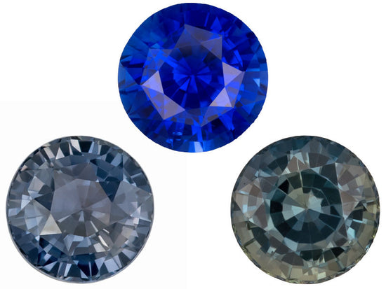 A grayish blue round sapphire, a vibrant blue sapphire, and a brownish teal saphire