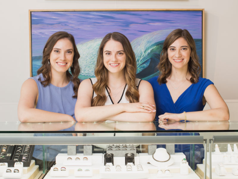 Left to right: Karen, Niki, and Charlotte Fox standing in Fox Fine Jewelry