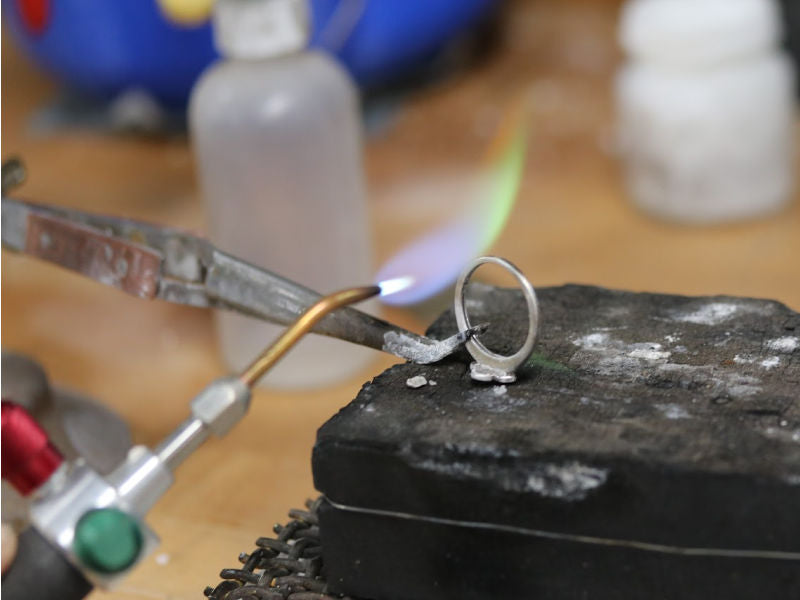 Sizing a silver ring with a torch