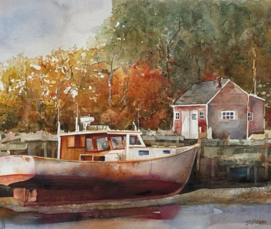 Boat docked at a small cabin with autumn trees in the background. Waiting for the Tide by Thomas Hoerber