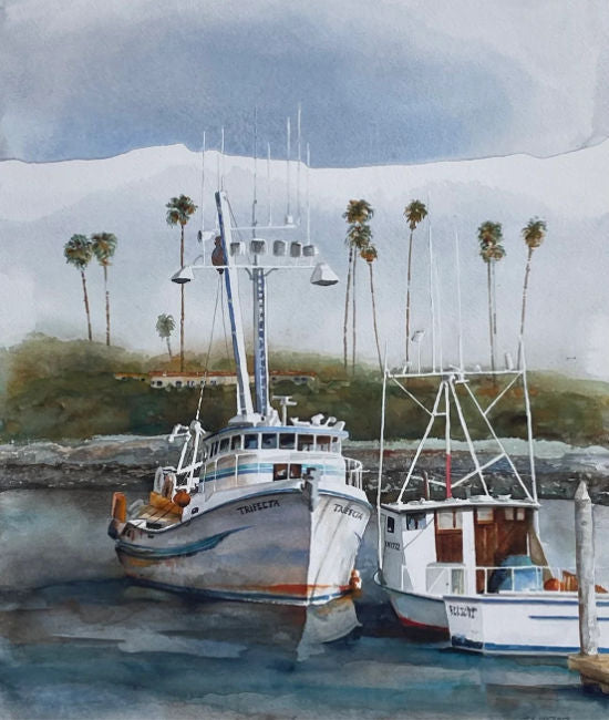 Two fishing boats docked at a harbor with palm trees in the background. Trifecta by Thomas Hoerberg