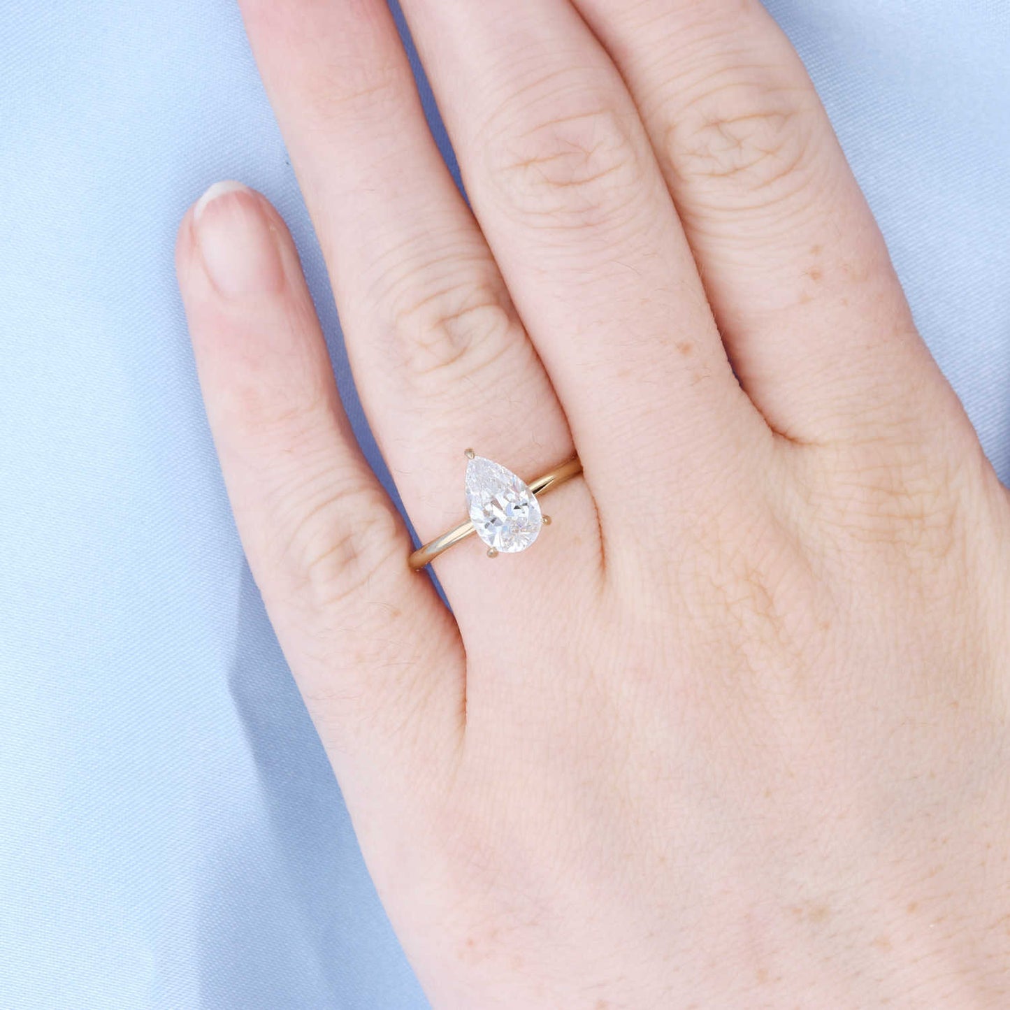 Pear Solitaire Hidden Halo Engagement Ring