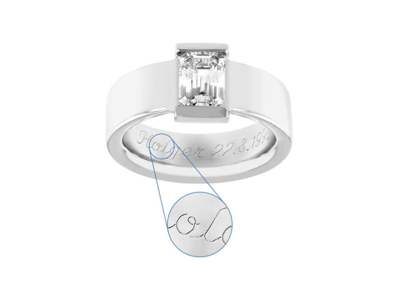 Solitaire diamond ring with engraving reading "Holger 22.8.1998" in script font