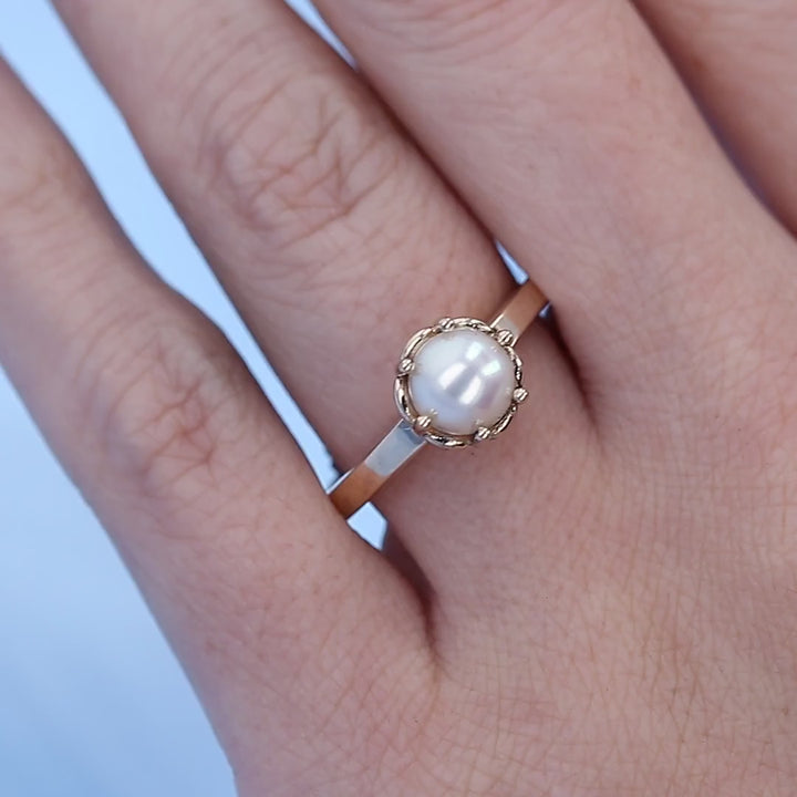 Pearl Solitaire Ring on a Finger