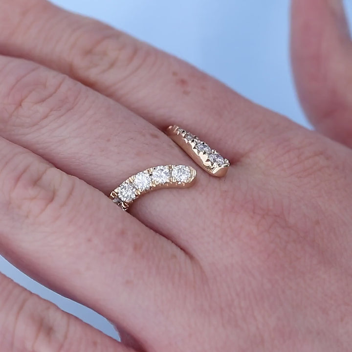 Open Chevron Diamond Wedding Band on a Finger
