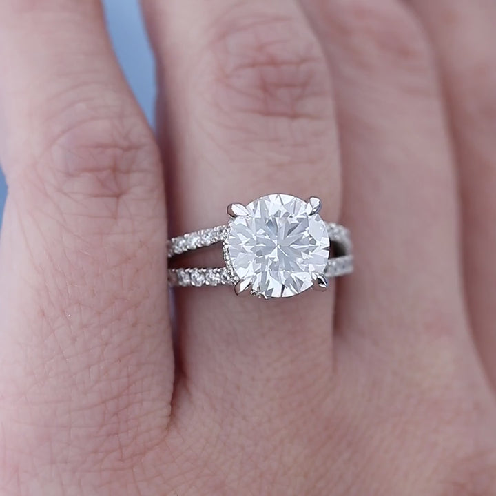 Split Shank Hidden Halo Diamond Engagement Ring on a Finger