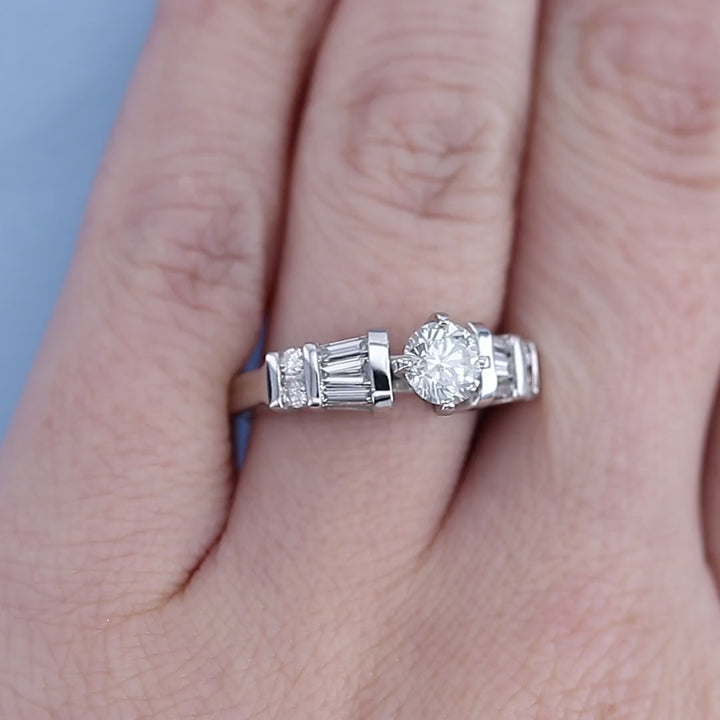 Round & Baguette Channel Set Diamond Engagement Ring on a  Finger