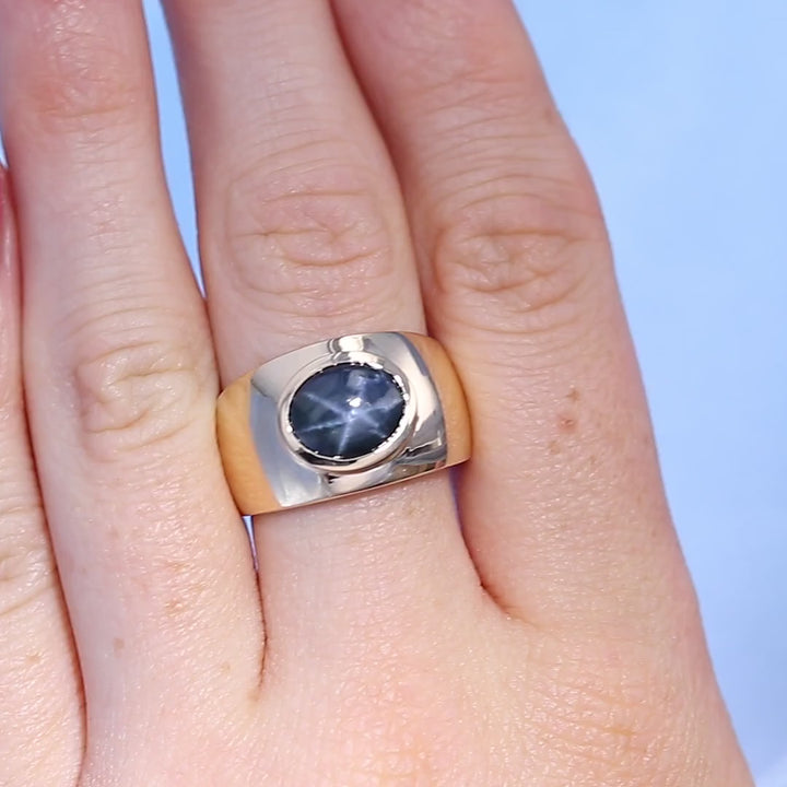 Bezel Set Star Sapphire Ring on a Finger