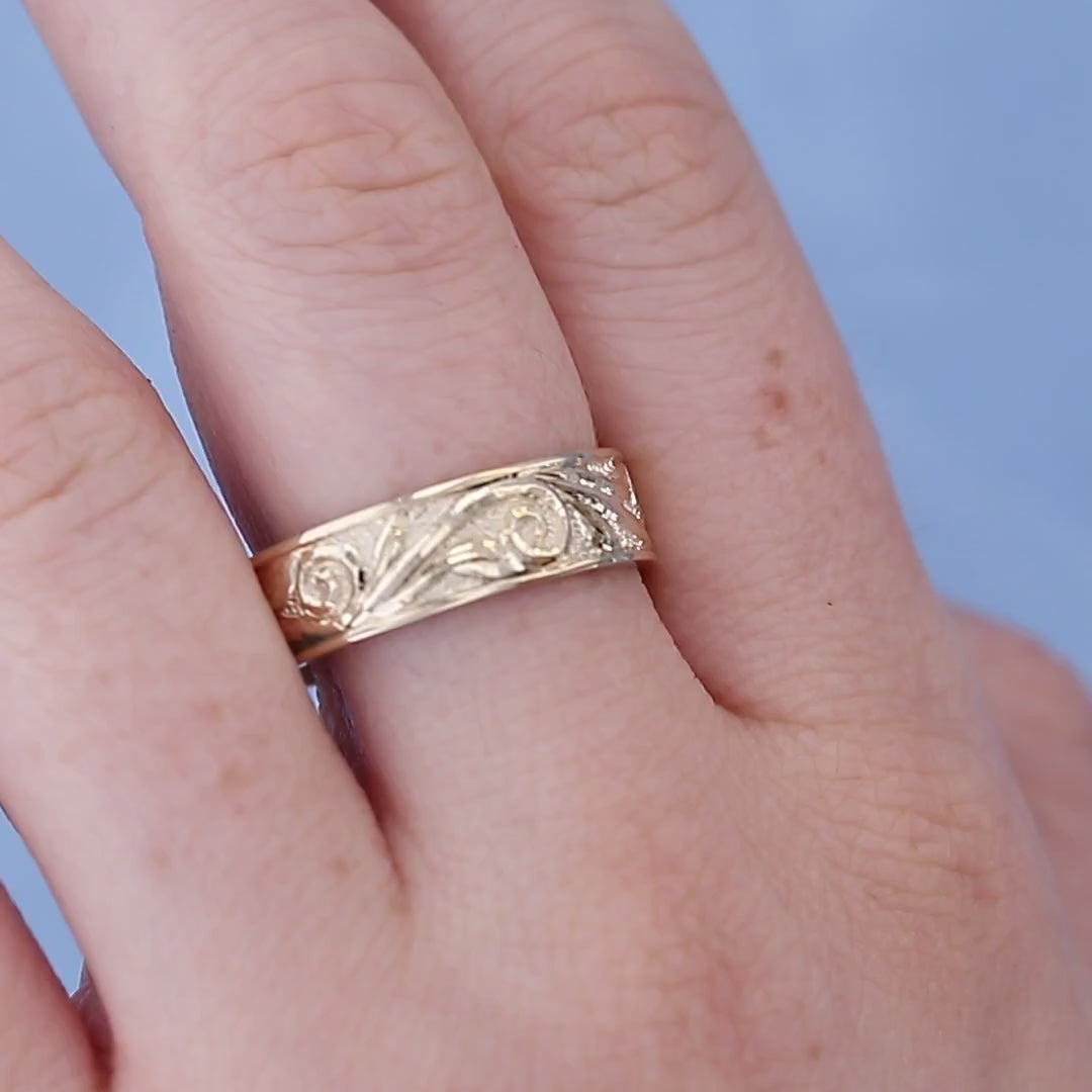 Yellow Gold Hand Engraved Band on a Finger