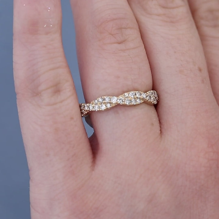 Twisted Diamond Wedding Band on a Finger