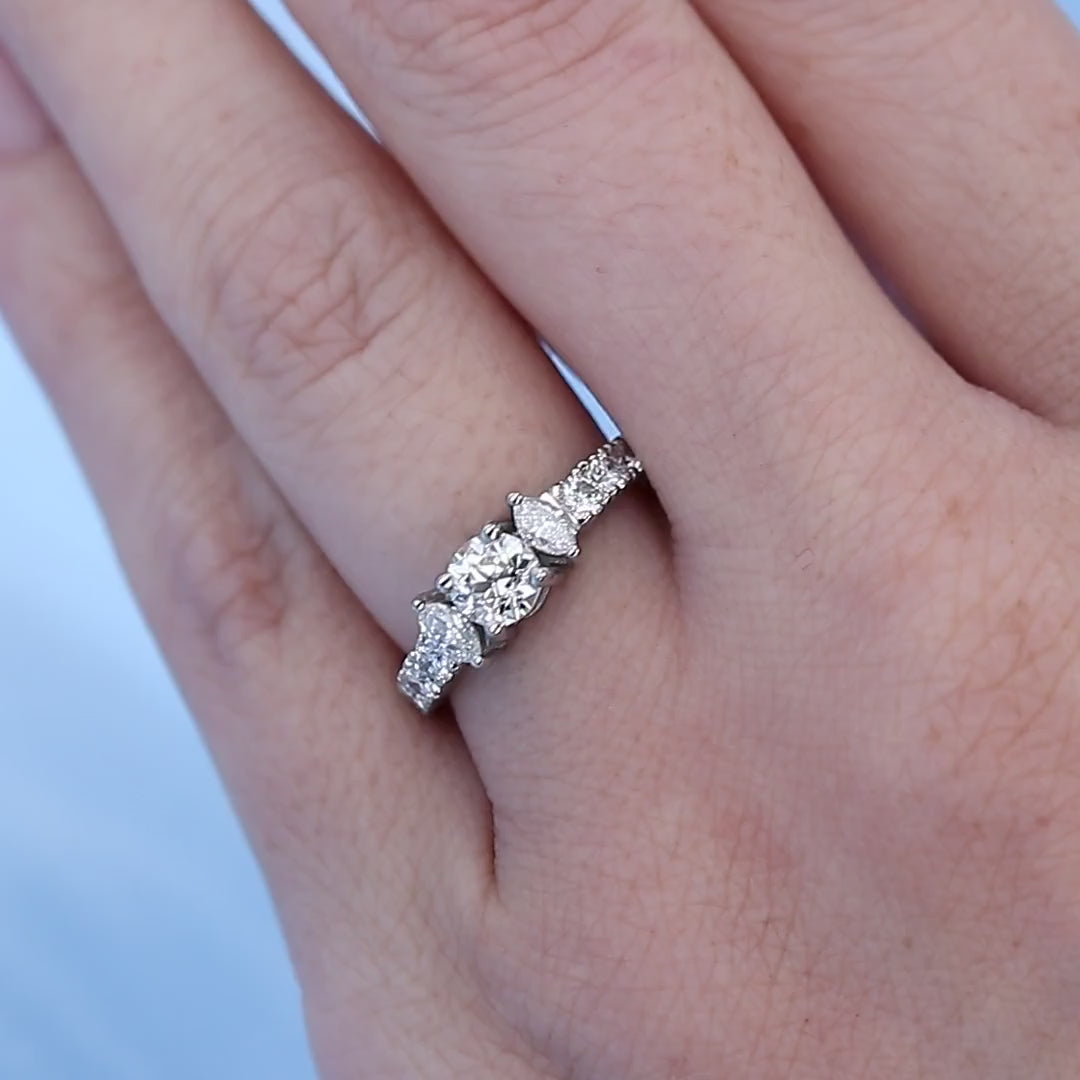 Platinum Marquise Three Stone Diamond Engagement Ring on a Finger