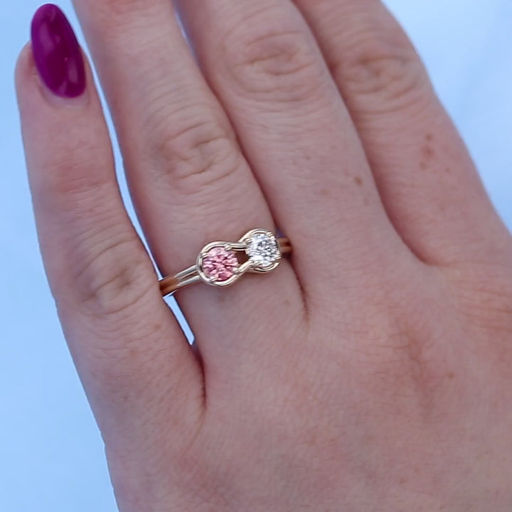 Pink Diamond Knot Ring on a Finger