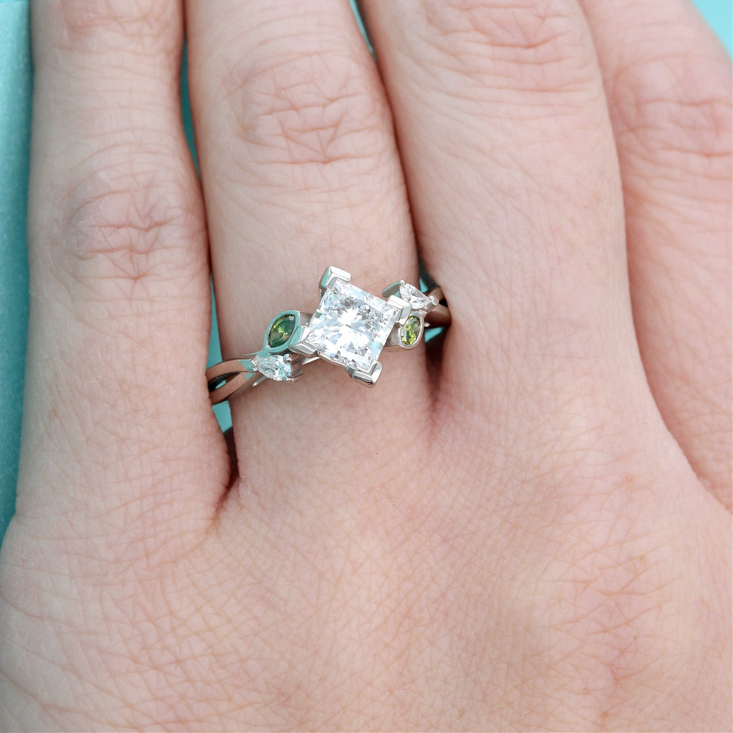 Green Diamond & Princess Cut Diamond Engagement Ring on a Finger