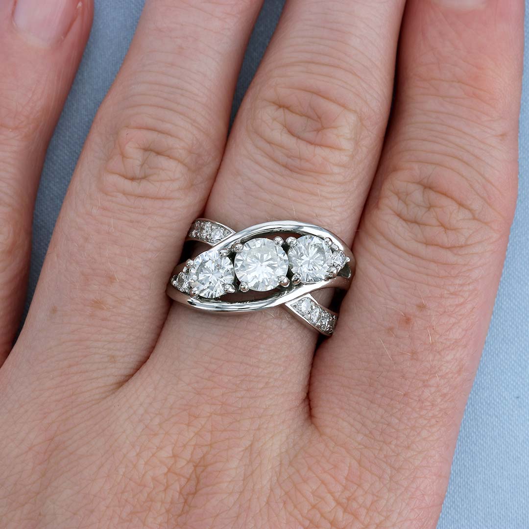Three Stone Criss Cross Wave Diamond Engagement Ring on a Finger