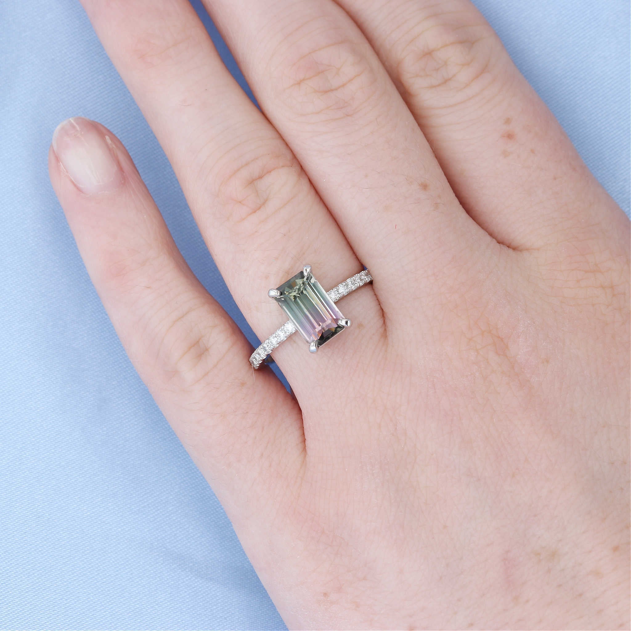 Emerald Cut Watermelon Tourmaline Engagement Ring on a Finger