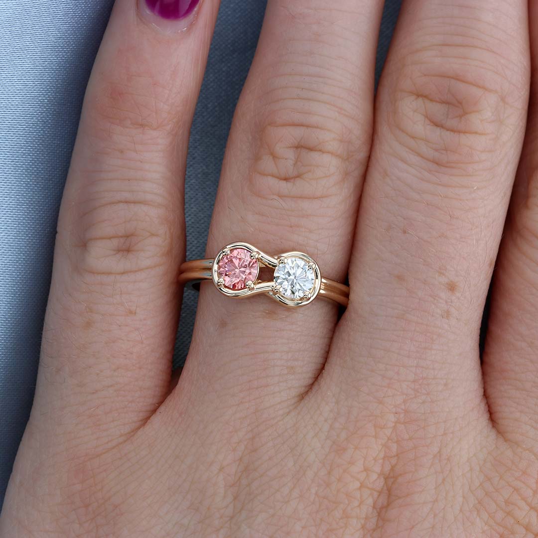 Pink Diamond Knot Ring on a Finger