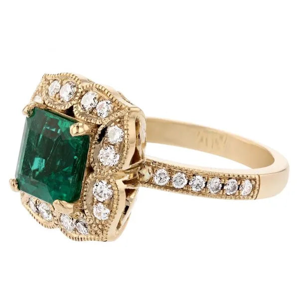 Antique emerald ring with floral diamond halo