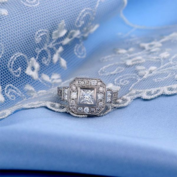 Princess Cut Halo Ring on Lace and Blue Fabric