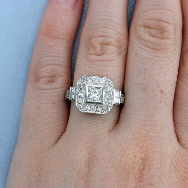 Princess Cut Halo Ring on a Finger